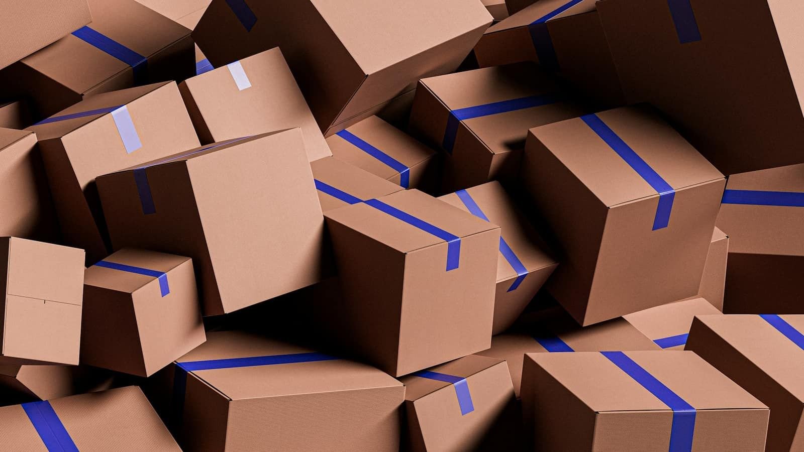 A large pile of brown cardboard boxes sealed with blue tape